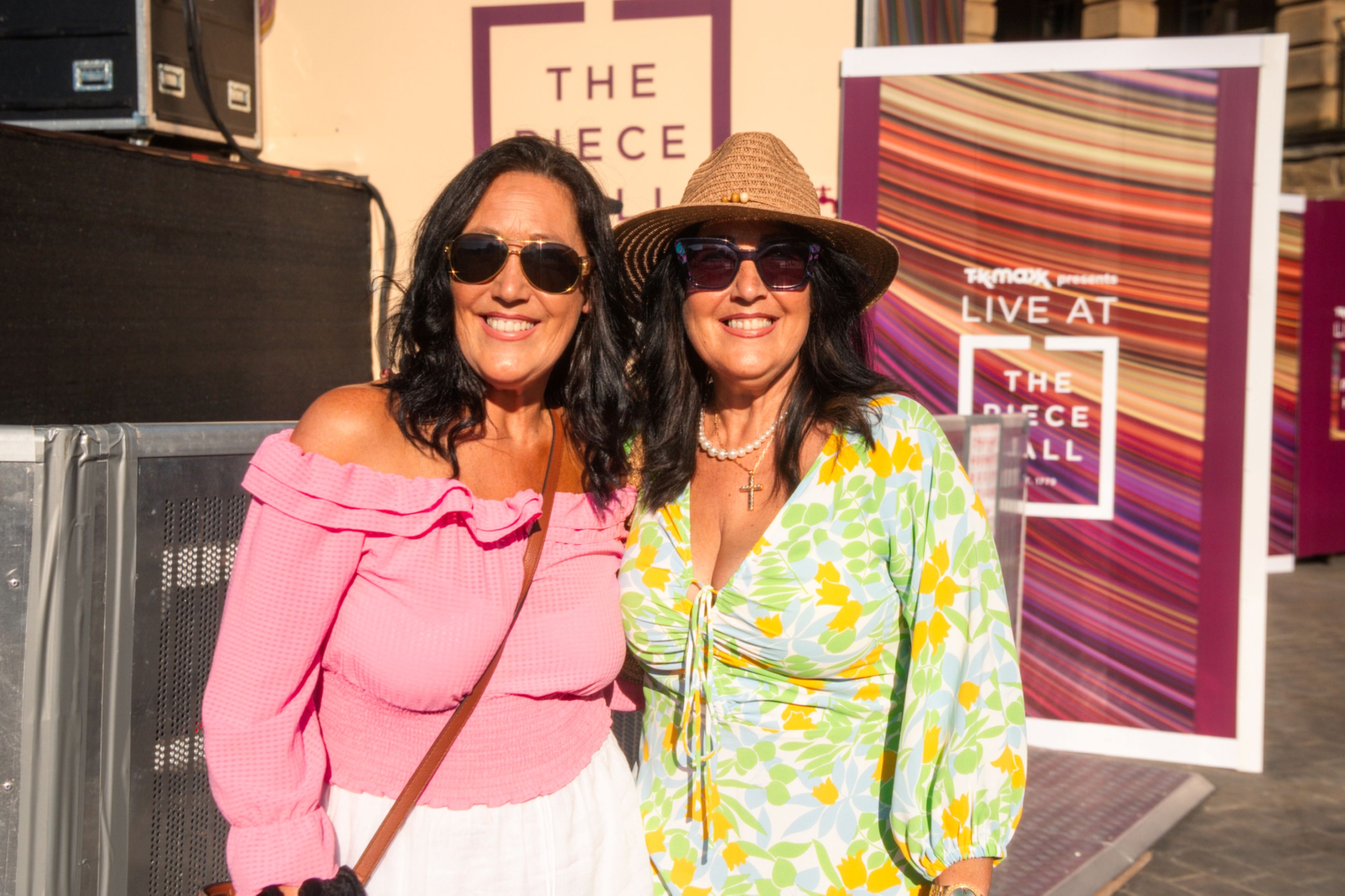 Two women in summer outfits at The Piece Hall festival