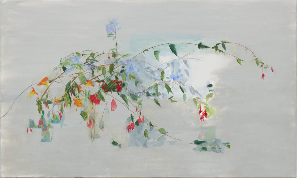 A delicate arrangement of colorful flowers and foliage against a soft, muted background, showcasing subtle textures.