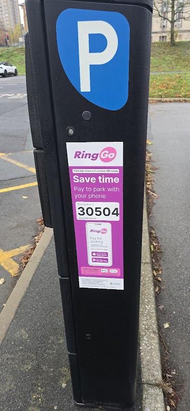 Parking meter with a "RingGo" payment sign, displaying instructions to pay by phone, in Jacobs Well Car Park, Bradford.