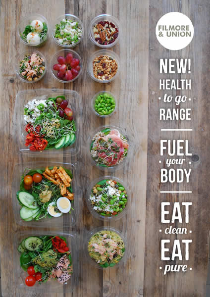 Healthy salad bowls and snacks on wooden table, Filmore & Union, Victoria Quarter, Leeds.