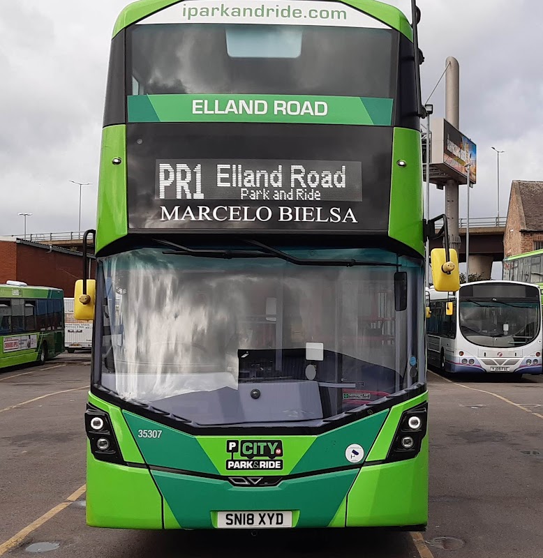 Green double-decker bus displaying "PR1 Elland Road Park and Ride" and "Marcelo Bielsa" parked in Hunslet.