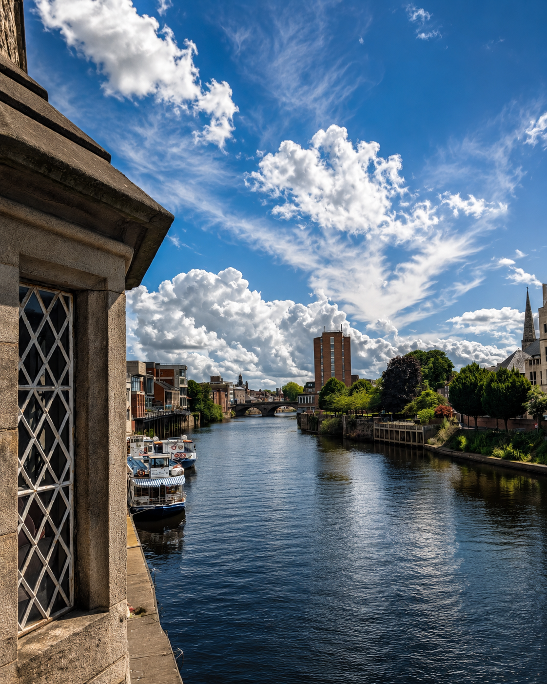 Scenic riverside view in Yorkshire with boats and historic architecture