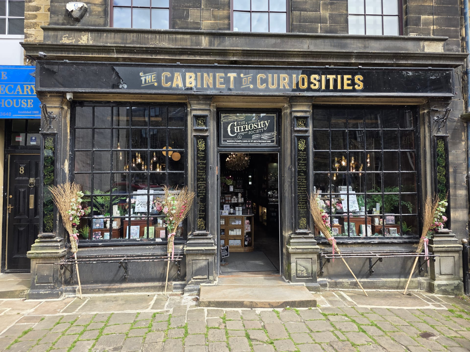 Charming vintage shopfront with large windows and curiosities on display