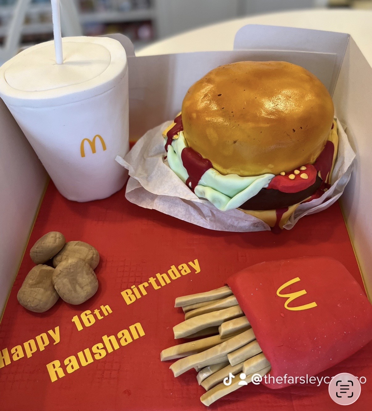 Unique cake shaped like a burger and fries with birthday message