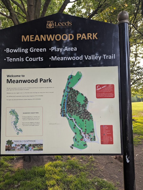 Sign for Meanwood Park featuring a map, listing amenities like a bowling green, play area, and tennis courts.