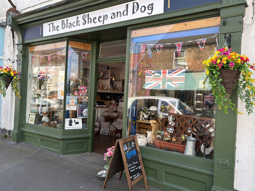 Quaint shopfront with floral displays, bunting, and a chalkboard sign reading "Open" in Patrington, Yorkshire.