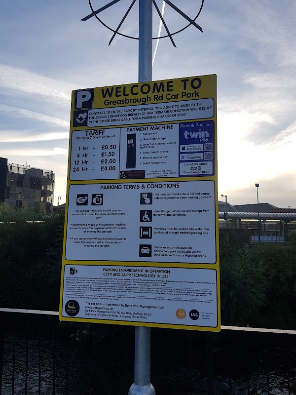 Welcome sign for Greasborough Road Car Park, detailing parking tariffs, payment options, and terms and conditions.