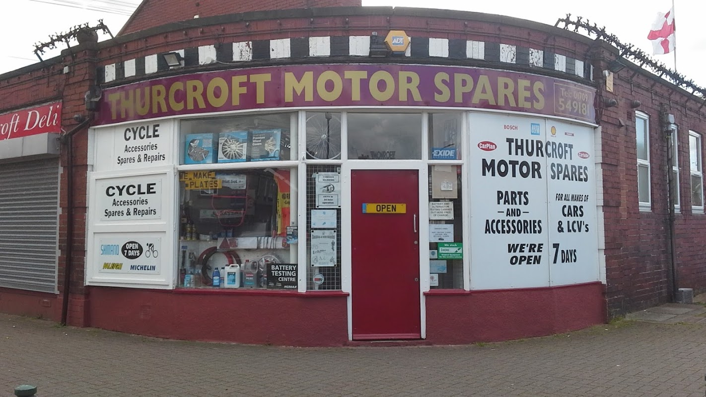 Thurcroft Motor Spares storefront featuring "OPEN" sign, cycle accessories, and various car parts displayed.
