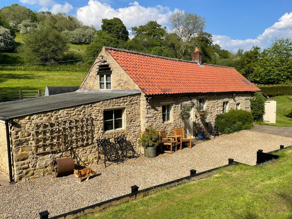Mill Cottage with waterfall in North Yorkshire Image 1