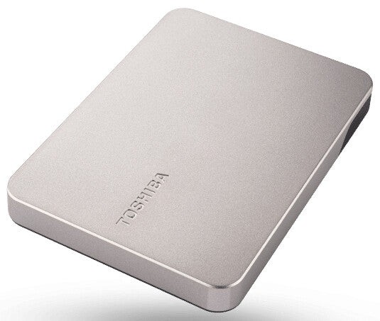 Silver Toshiba Canvio Flex 2 TB external hard drive with a sleek, slim design, featuring a smooth surface and the Toshiba logo embossed on the front.