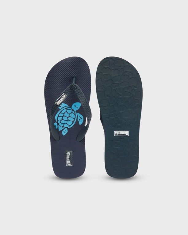 Blue rubber flip flops featuring a turtle design on the footbed, textured sole for grip, and a comfortable thong strap, available in size 40/41.