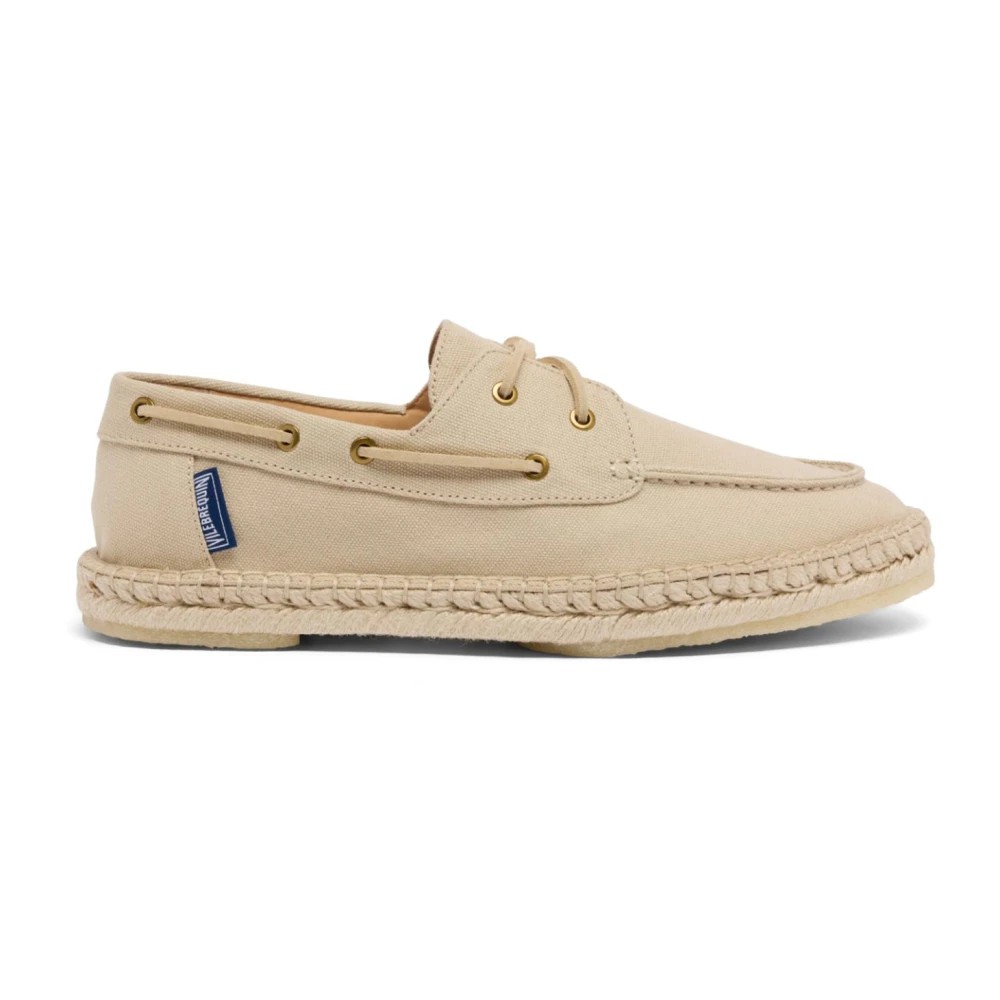 White canvas loafers with a braided jute sole, featuring gold eyelets and a blue Vilebrequin logo tag, designed for men in size 43.