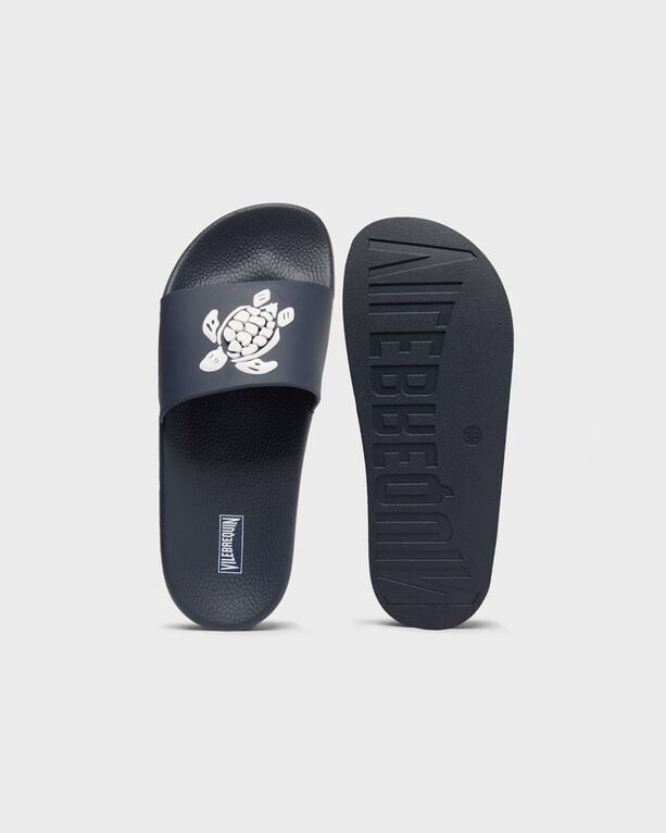 Blue beach slider sandals featuring a white turtle graphic on the strap, textured footbed, and a durable sole, size 43 by Vilebrequin.