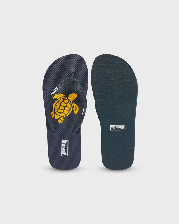 Orange flip flops by Vilebrequin featuring a turtle design on the footbed, textured rubber sole, and a comfortable thong strap, available in size 38/39.