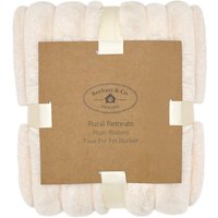 Almond plush ribbed faux fur pet blanket, rolled and secured with a brown cardboard band, by Banbury & Co.