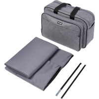 Gray Safety 1st changing bag with black handles, folded travel cot, and two black support rods.