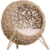 Ball-shaped wicker cat house with natural rattan weave and raised wooden legs, featuring a soft cushion inside.