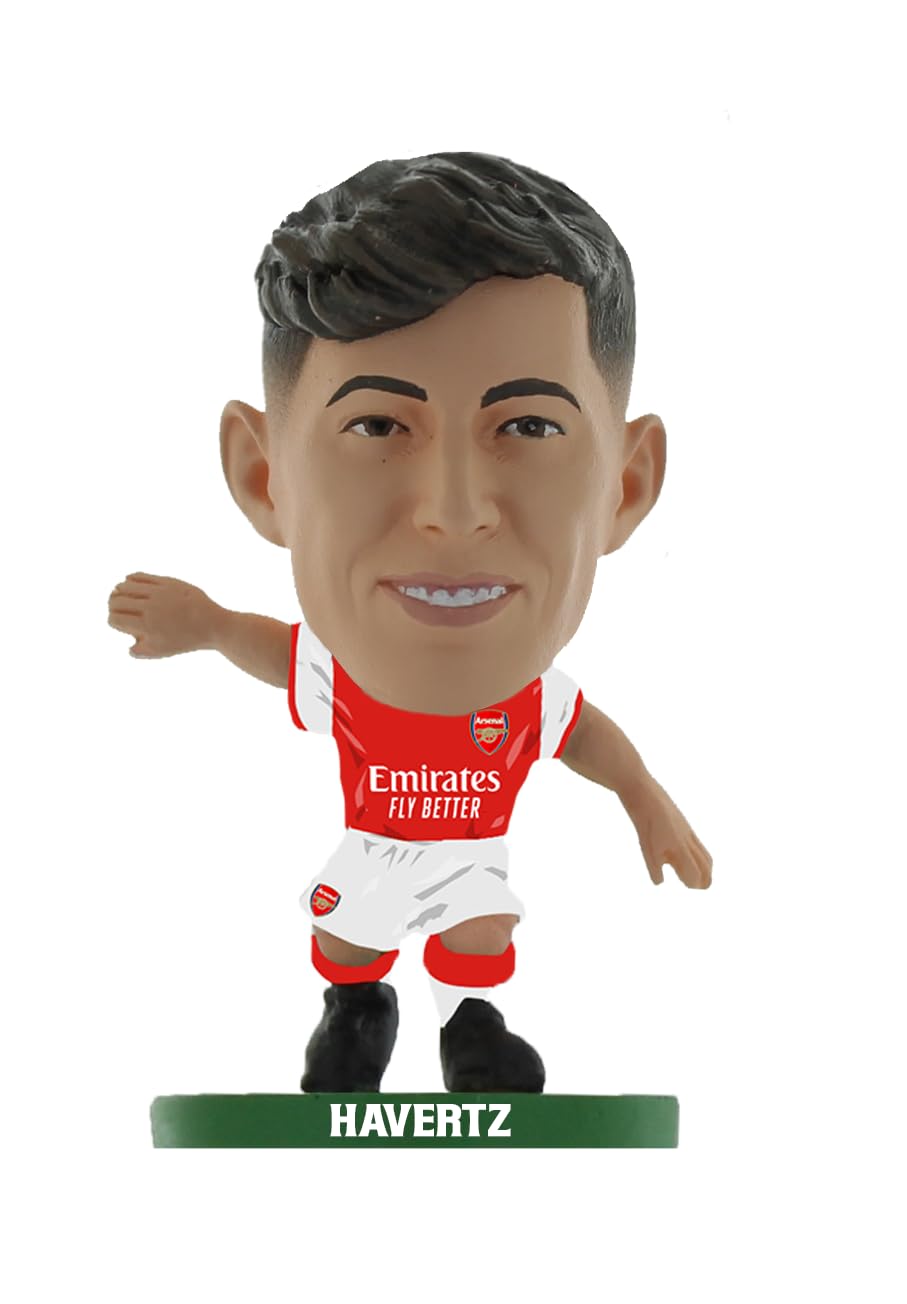 Collectible figurine of Kai Havertz in an Arsenal home kit, featuring a red jersey with white sleeves, black hair, and a green base labeled "HAVERTZ."