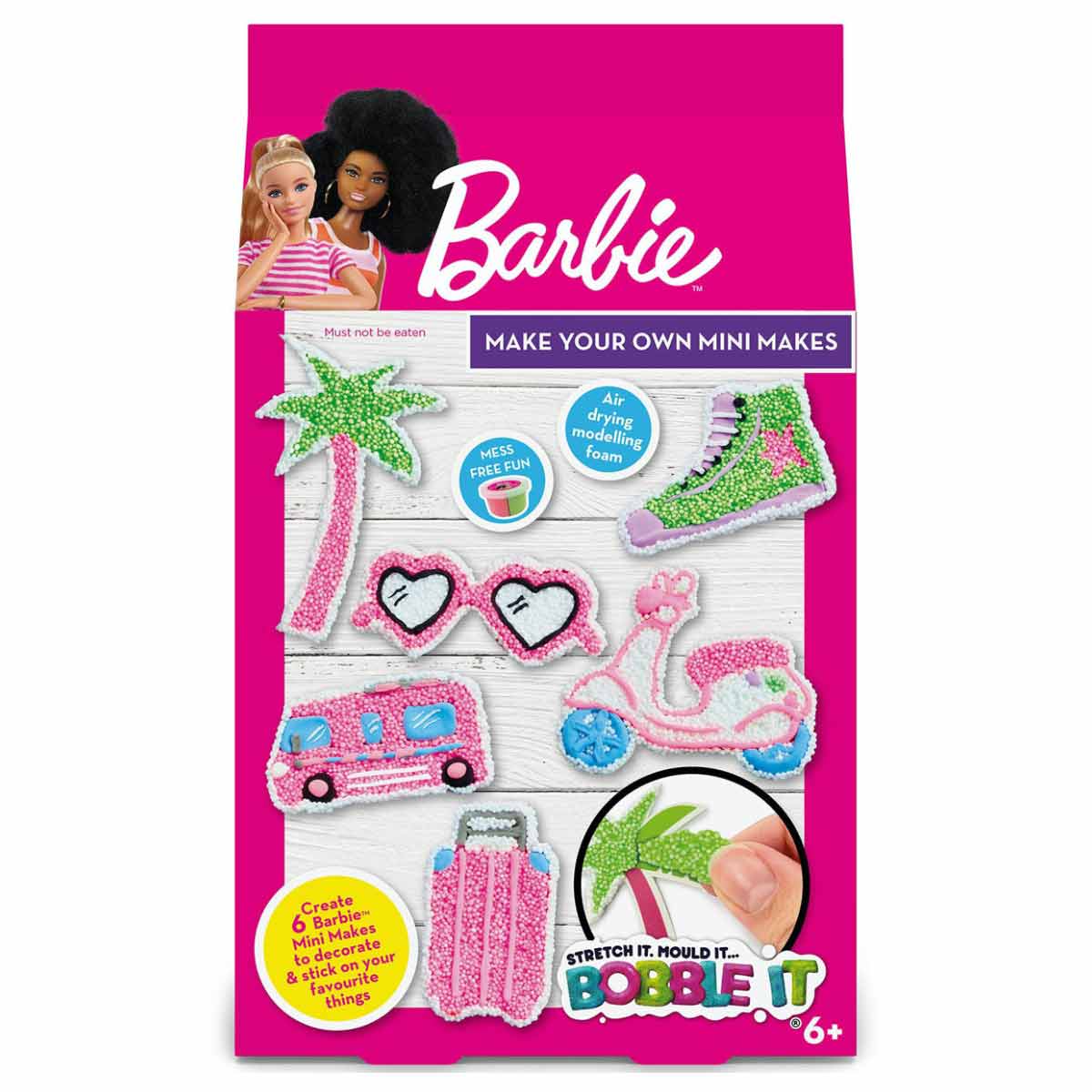 Colorful craft set featuring air-drying modeling foam pieces to create mini accessories, including sunglasses, a flamingo, and a camper van, with a vibrant pink background.