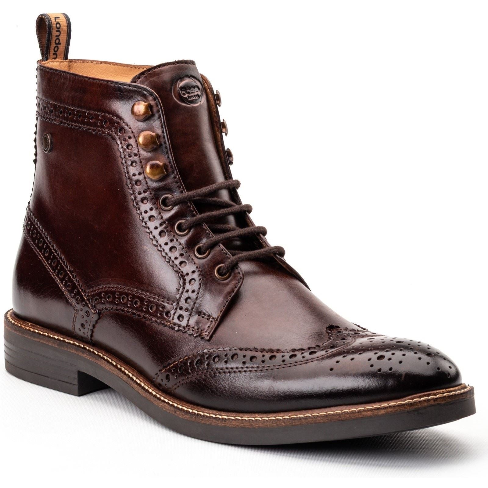Burnt brown leather brogue shoes featuring decorative perforations, a lace-up front, and a sturdy sole, showcasing a classic and stylish design by Base London.