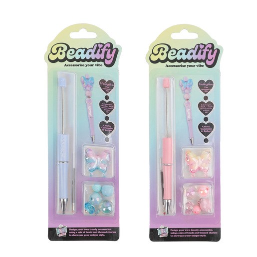 Two Beadify Pen Charms Craft Sets featuring pastel-colored pens in blue and pink, each with decorative charms and assorted beads, packaged in clear plastic with vibrant backgrounds.
