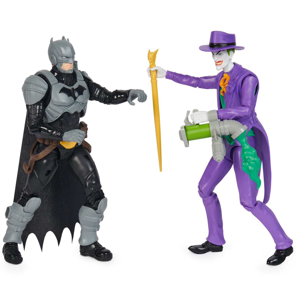 Batman in a black suit with gray armor and a flowing cape faces the Joker, who wears a purple suit and holds a green weapon and yellow umbrella, both standing 30cm tall.