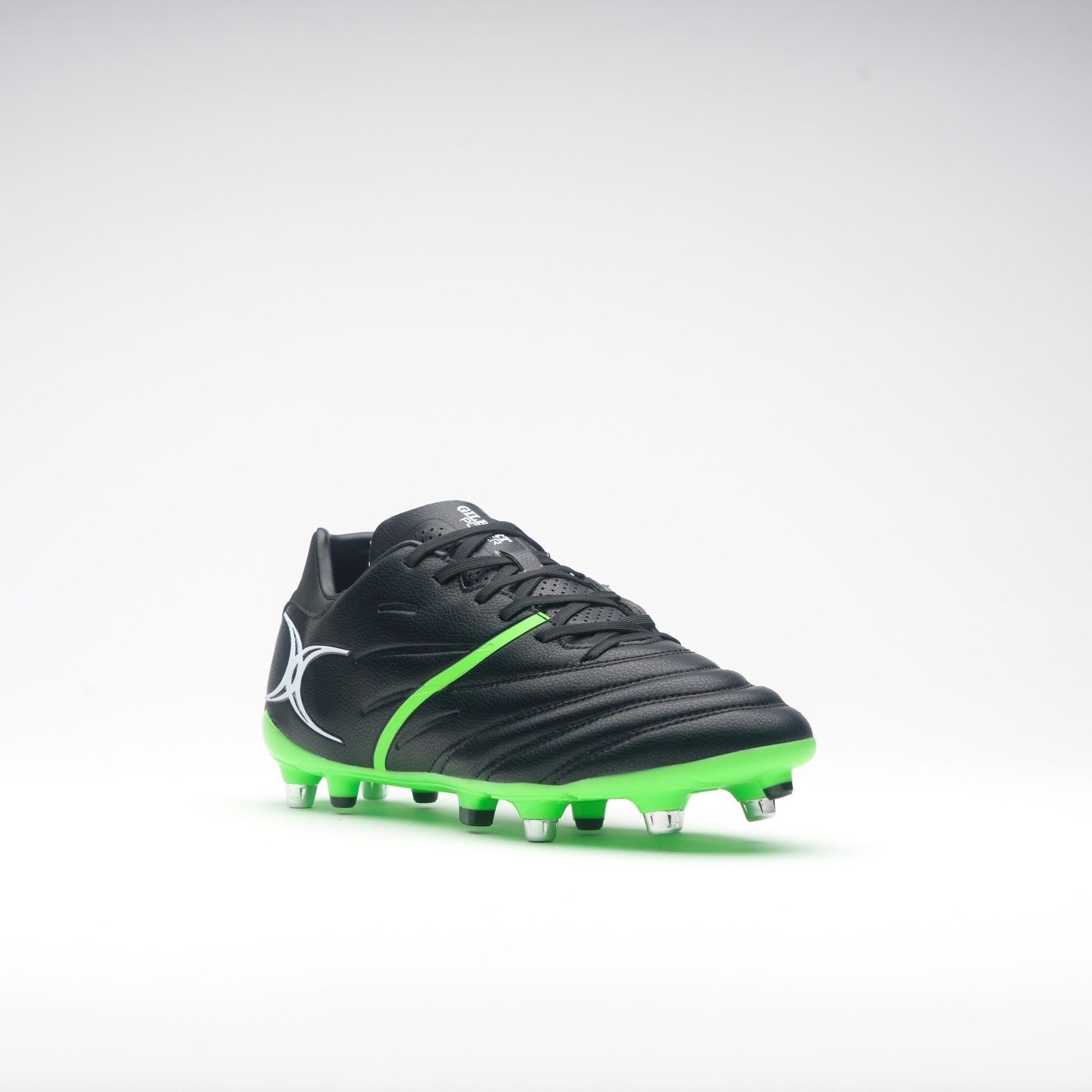 Black rugby boots with a sleek design, featuring a green accent stripe, textured upper for grip, and multiple studs for traction on the field.