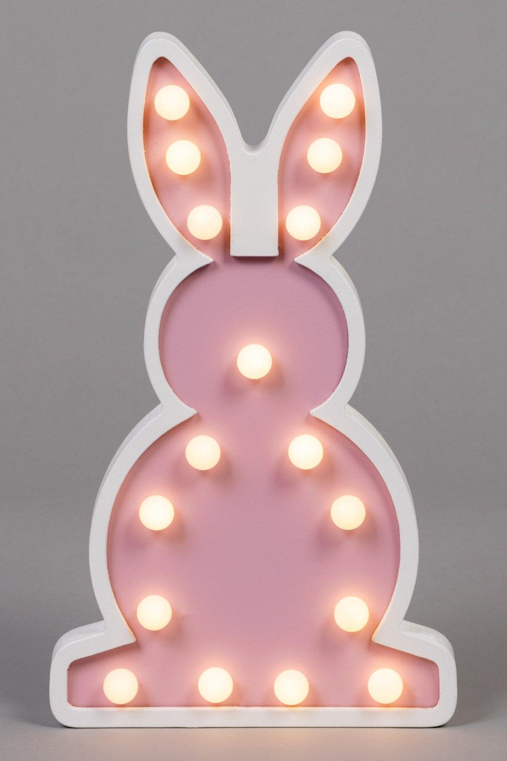 Pink bunny-shaped table lamp with a white base, featuring round LED lights embedded in its body, creating a soft glow.