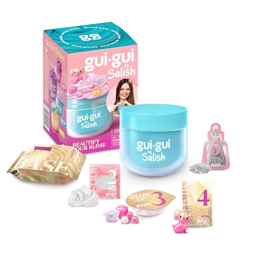 Light blue container with a clear lid, surrounded by colorful slime accessories, including glitter, charms, and a pink box featuring a smiling girl and product details.