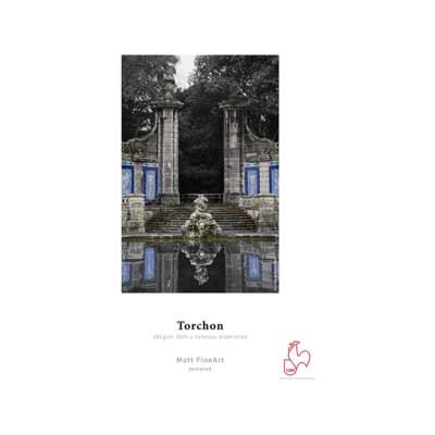 A textured, off-white Torchon paper with a matte finish, featuring a detailed image of a classical fountain and stone steps, accented with blue and grey tones.