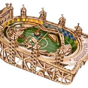 Wooden Quidditch flipper model featuring intricate castle towers, a green playing field, and colorful team banners, showcasing a detailed design inspired by Harry Potter.