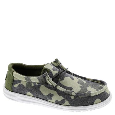 Men's HEYDUDE Wally Washed Camo Shoe features a green and gray camo pattern, lightweight fabric upper, lace-up design, and a white rubber sole for comfort and style.