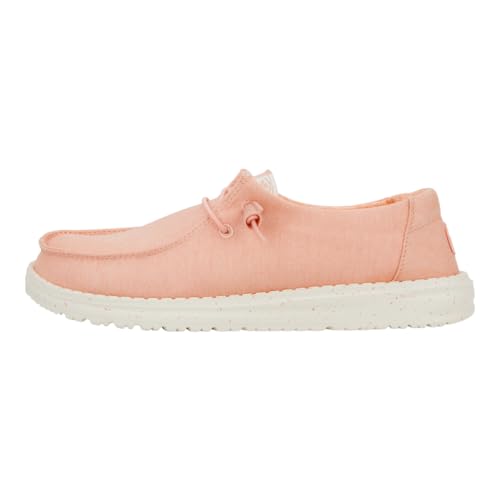 Light pink canvas shoe with a soft texture, featuring a lace-up design, a white rubber sole, and a casual, comfortable style ideal for everyday wear.