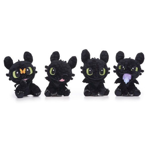 Four 18cm Toothless soft toys in varying styles, featuring black plush material, large green eyes, and playful expressions, with details like a butterfly and tongue sticking out.