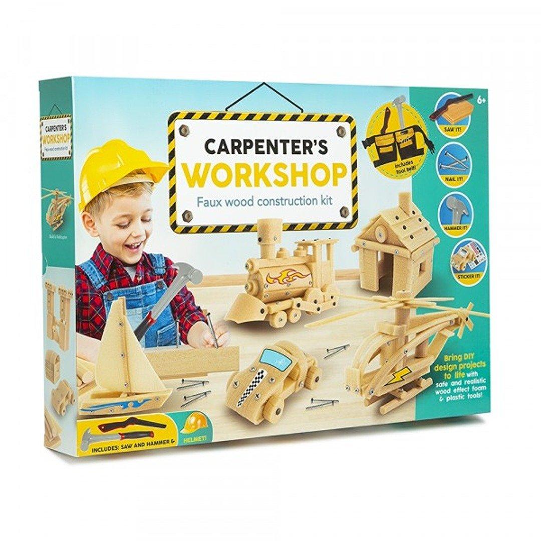 Colorful box featuring a young boy in a yellow hard hat, surrounded by faux wood craft pieces, tools like a saw and hammer, and various construction projects like a train and helicopter.