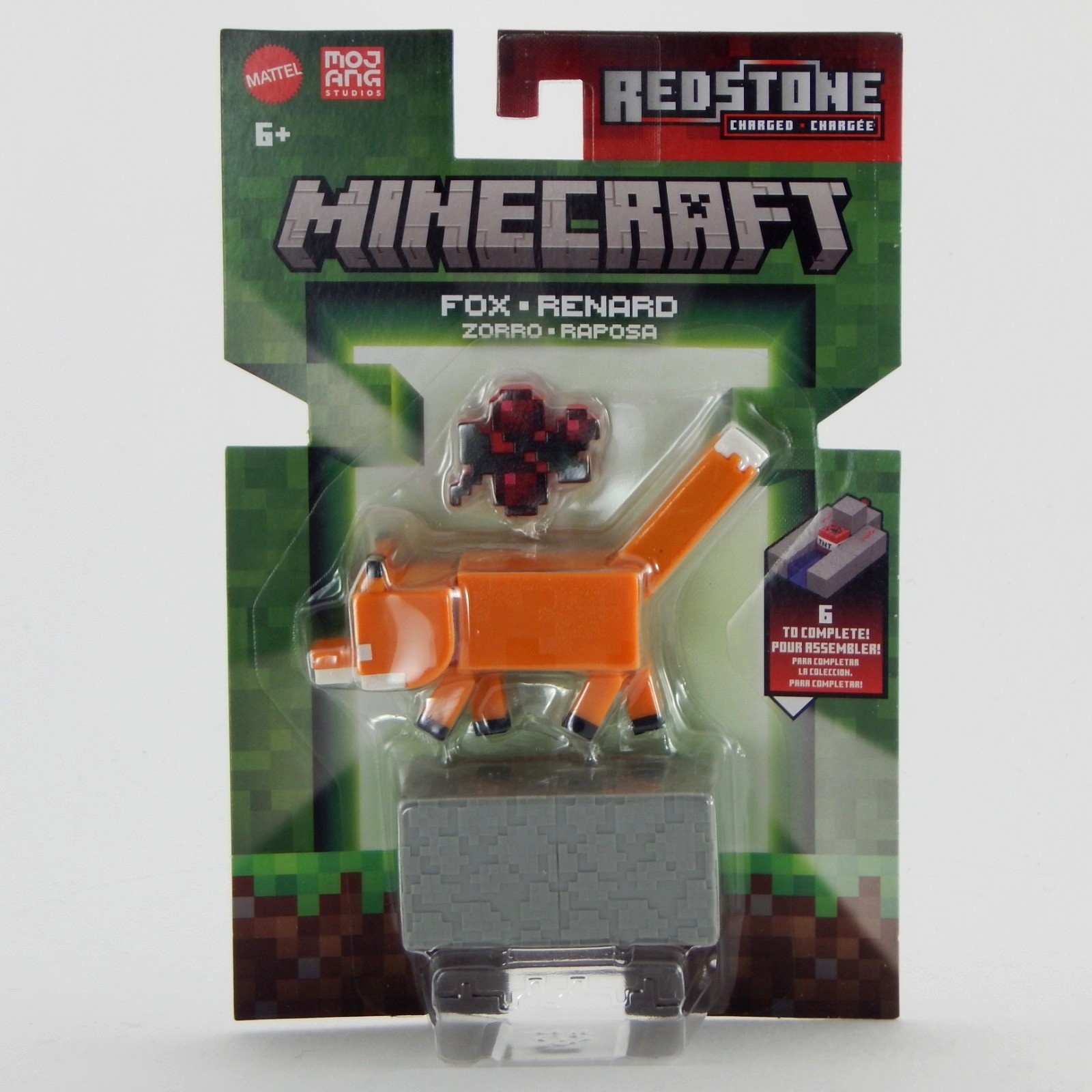 Minecraft Fox action figure in orange, with a building piece and a redstone accessory, packaged in a colorful box featuring pixelated graphics and the Minecraft logo.