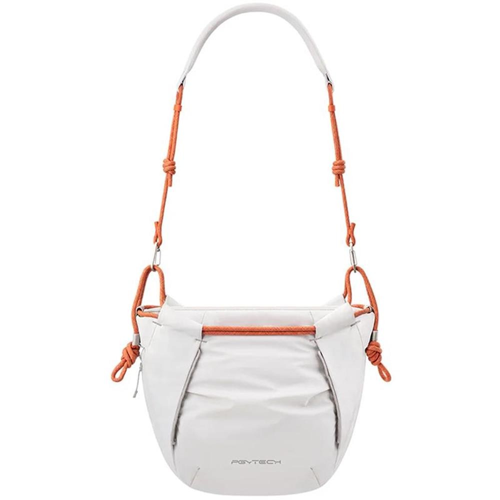 PGYTECH OneGo Rope Strap Bag in orange and white, featuring a sleek design, adjustable rope strap, and a zippered front pocket for easy access.