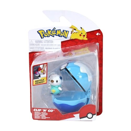 Blue Dive Ball with a hinged top, featuring a small Oshawott figure attached, packaged in a vibrant Pokémon-themed box with Pikachu graphics.