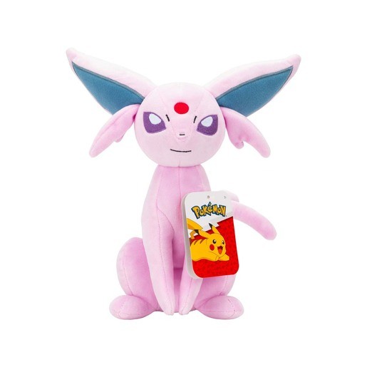 Pink Espeon soft toy with large blue ears, purple eyes, and a red gem on its forehead, featuring a Pokémon tag attached to its paw.