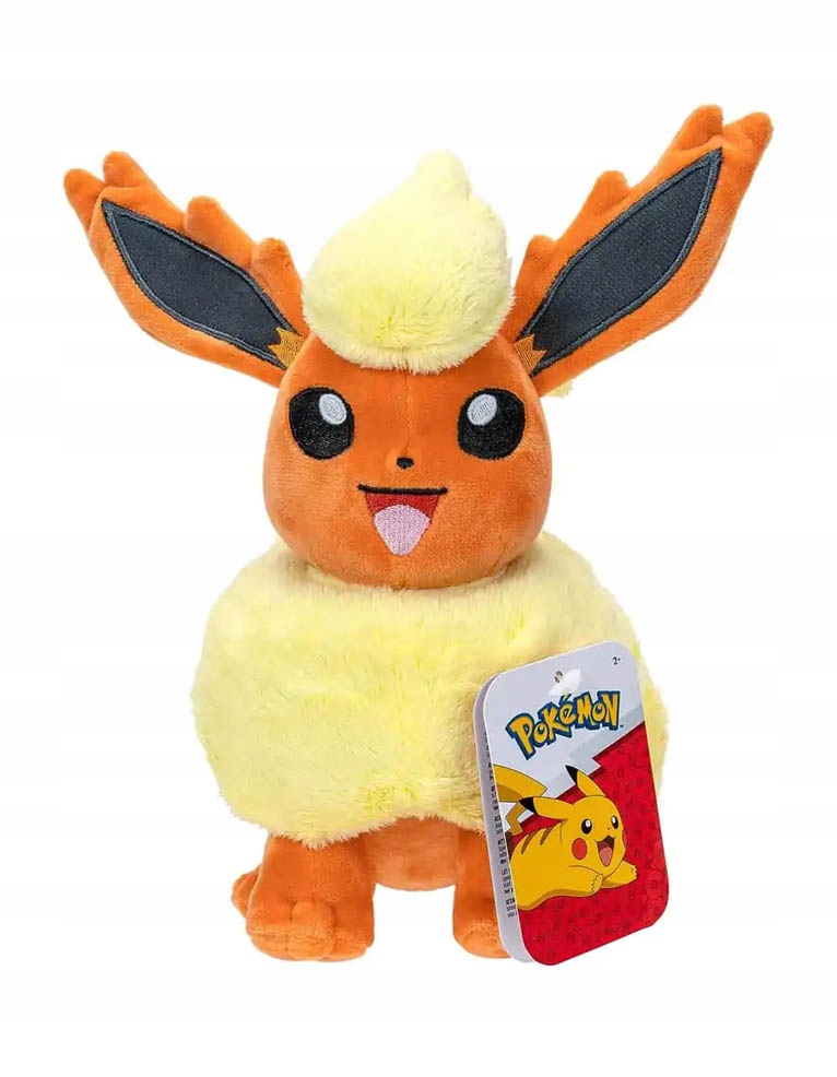 Flareon soft toy featuring bright orange fur, a fluffy yellow mane, large black-tipped ears, and a playful expression, complete with a Pokémon tag.