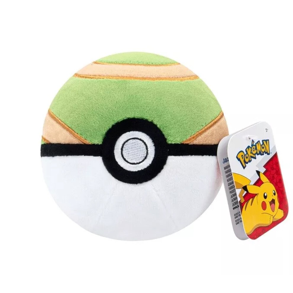 Round, plush Nest Ball soft toy in green and beige with a black circle in the center, accompanied by a colorful Pokémon tag featuring Pikachu.