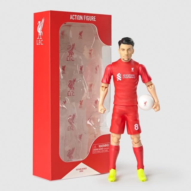 Red action figure of a football player wearing a Liverpool FC kit, holding a white ball, with a detailed box featuring the team's logo and branding.