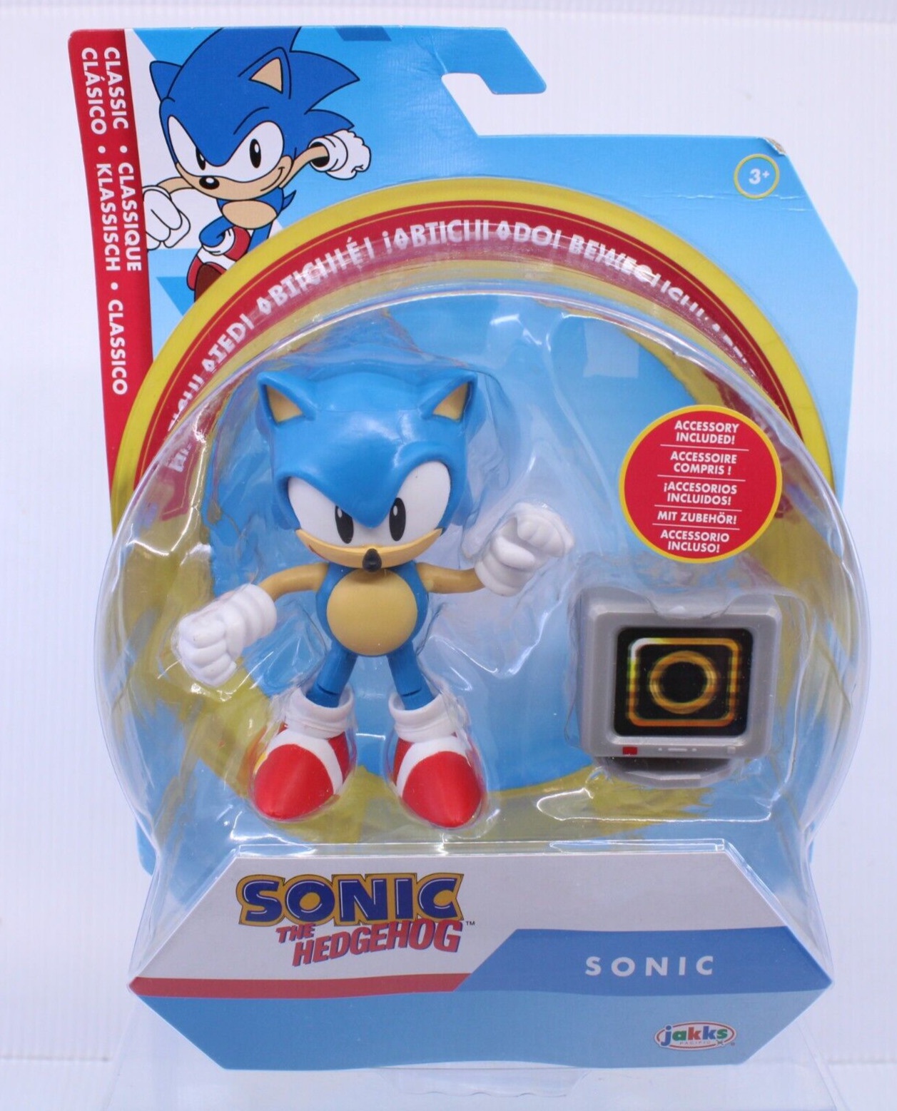 Posable Sonic the Hedgehog figure in blue with red shoes, packaged with a black ring box, featuring classic design elements and vibrant colors.