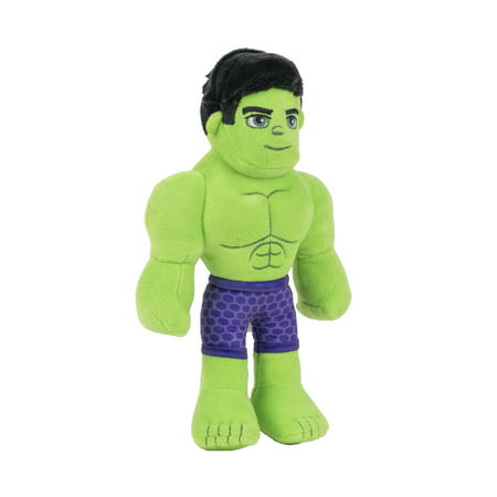 Green plush Hulk toy with a muscular build, wearing purple shorts with a hexagonal pattern, and featuring black hair and facial details.