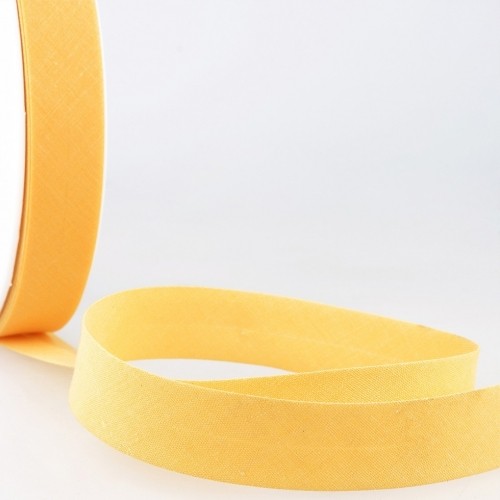 27mm maize yellow polycotton bias binding tape, featuring a smooth texture and a soft sheen, rolled and partially unspooled on a white background.