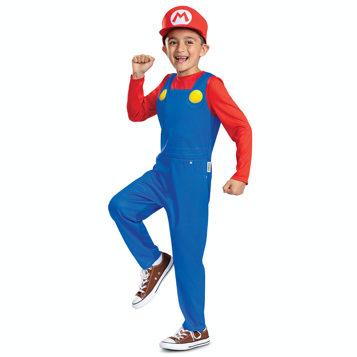 Bright blue overalls with yellow buttons, a red long-sleeve shirt, and a red Mario cap featuring an "M" logo, worn by a child posing enthusiastically.