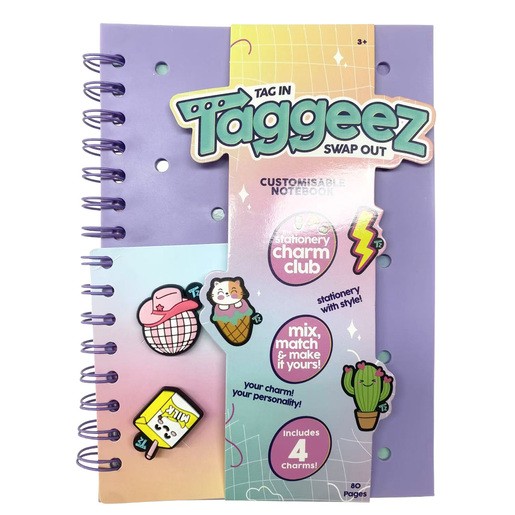 Customizable notebook craft set featuring a purple and lavender cover, spiral binding, and four interchangeable charms including a cactus, ice cream, and a cute character.