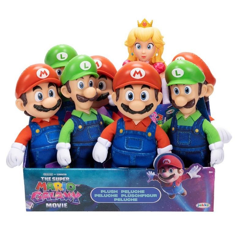 Colorful plush figures from the Super Mario Galaxy movie, featuring Mario, Luigi, and Princess Peach, with varying styles and accessories in a display box.