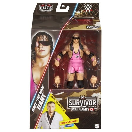 Bret "Hitman" Hart action figure in pink attire, featuring interchangeable hands, packaged in a colorful box with Survivor Series branding and a photo of Nick Aldis.