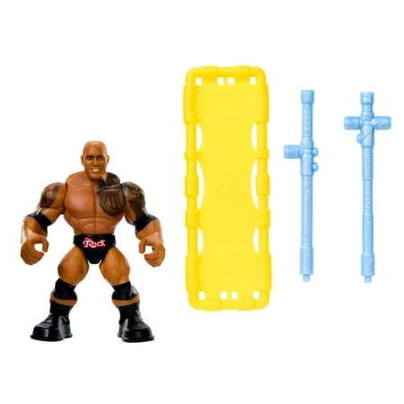 WWE Knuckle Crunchers The Rock figure features a muscular figure with a tattoo, wearing black trunks with "Rock" text, accompanied by a yellow launcher and two blue accessories.